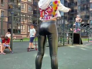 Blonde street girl is showing her leather leggings ass in public!